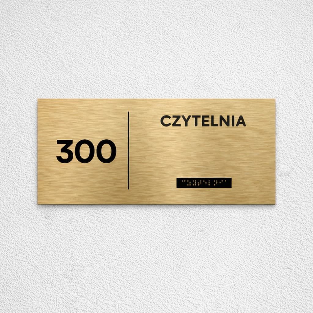 Złota tabliczka Braille czytelni z numerem sali 300