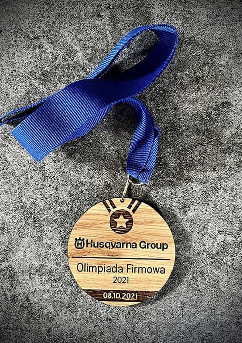 Medale grawerowane laserowo dla firmy Husqvarna Group na Olimpiadę Firmową.